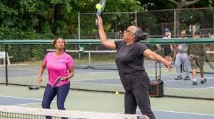 Young athlete sitting reflectively on the field, symbolizing mental challenges in youth sports